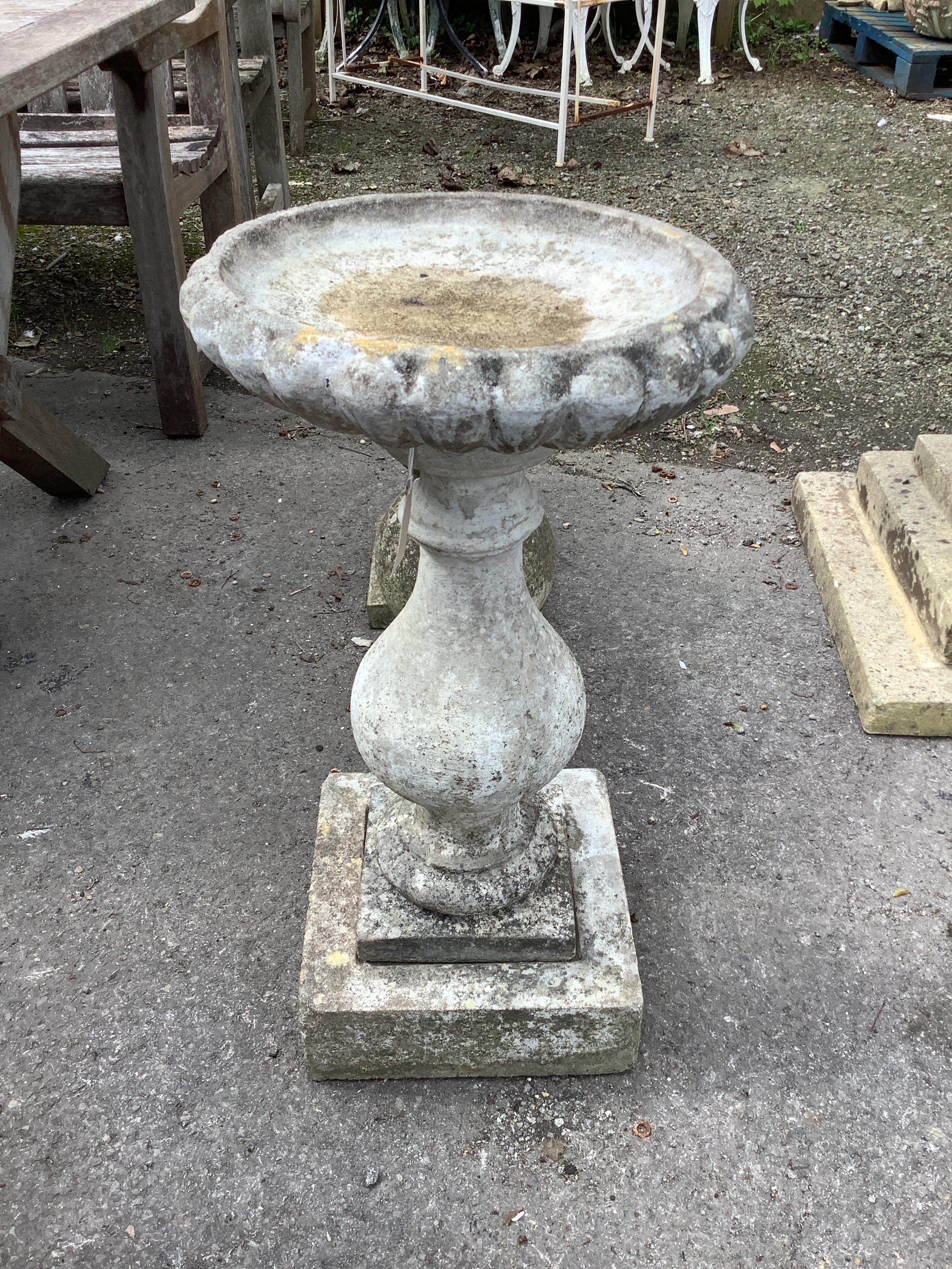 A reconstituted stone baluster bird bath, height 69cm